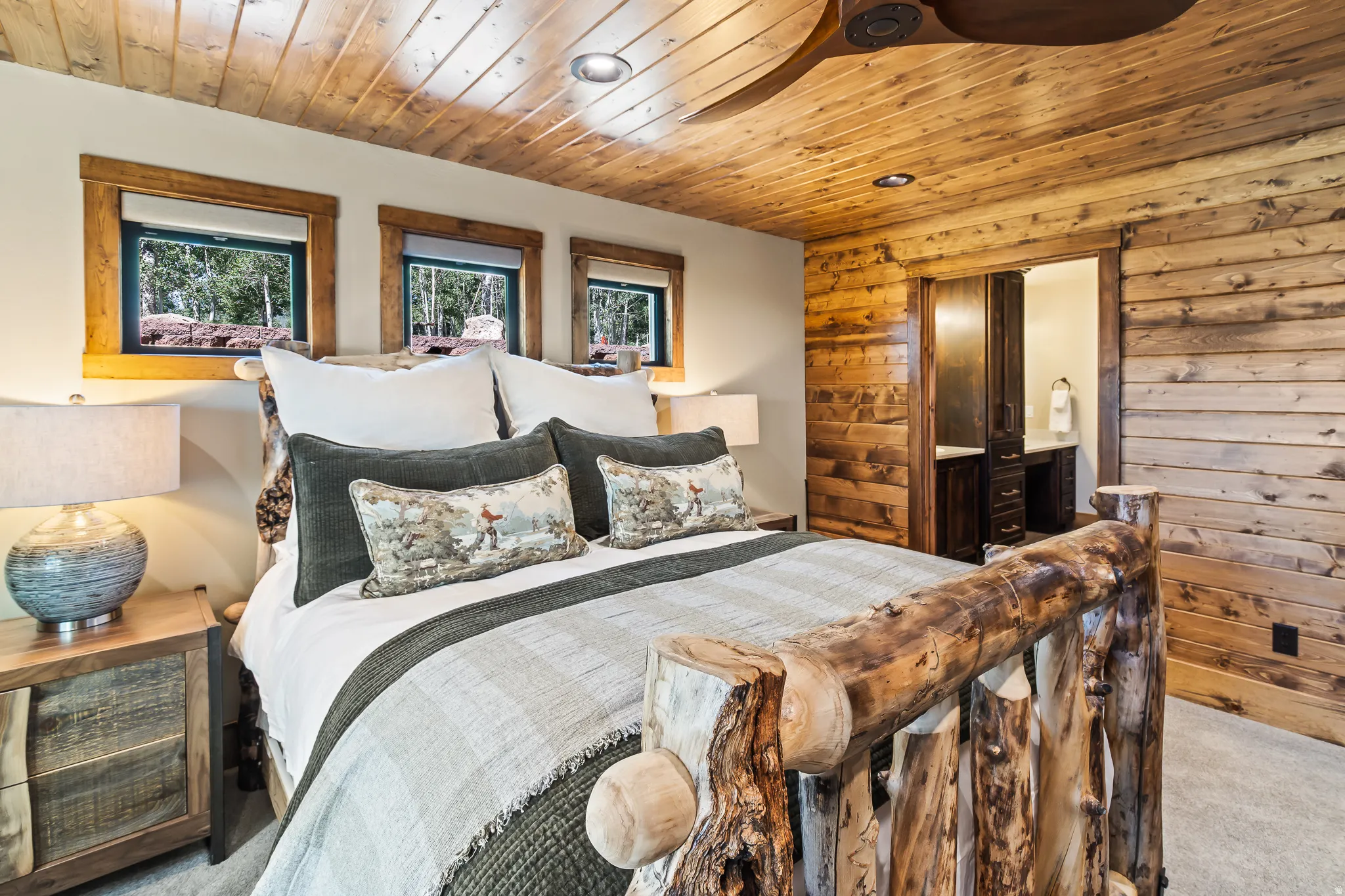 Wood-paneled ceiling with recessed lighting and a ceiling fan