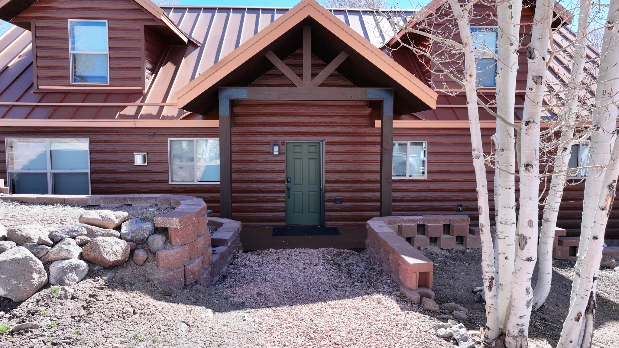 Wood-look siding exterior with a metal roof