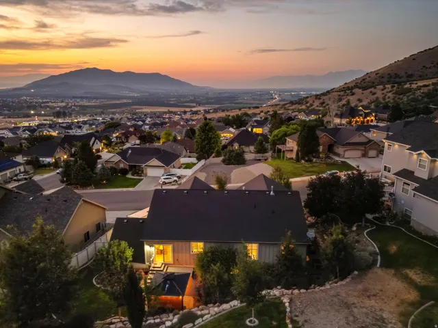 Mountain scenery, developed neighborhood, paved streets, and residential architecture