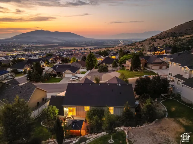 Mountain scenery, developed neighborhood, paved streets, and residential architecture