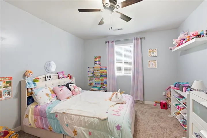 Neutral painted walls with recessed lighting and a ceiling fan