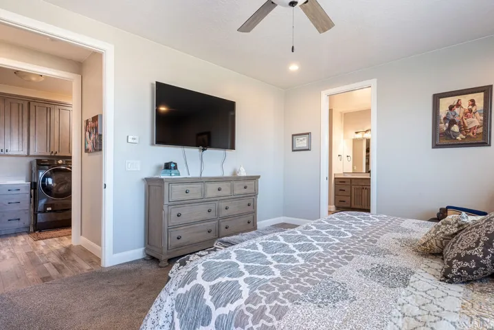 Recessed lighting, ceiling fan, and carpeted flooring