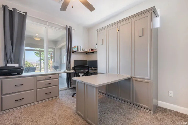 Built-in cabinetry with integrated desk and storage drawers