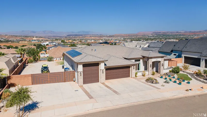 Contemporary exterior with stone accents and a tile roof