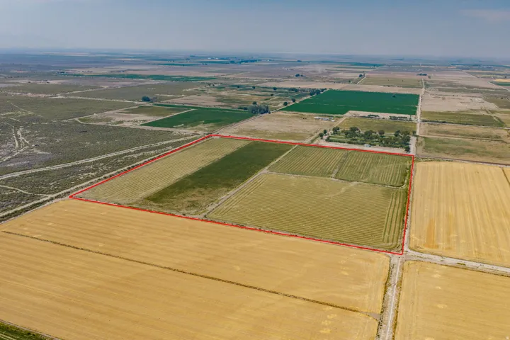 Expansive agricultural property featuring multiple cultivated fields and visible parcel boundaries