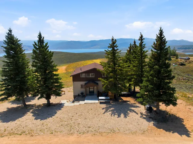 Charming mountain residence set on expansive grounds surrounded by mature evergreen trees
