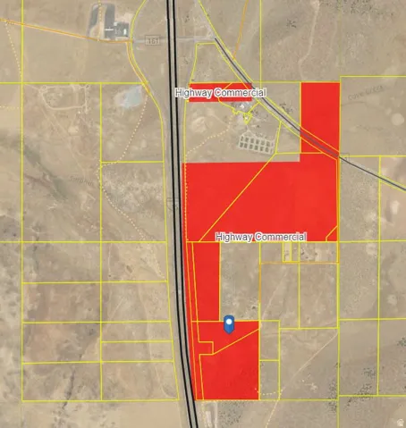 Zoning Map. Commercial property parcels delineated in red, with highway corridor access and lot boundaries indicated by yellow lines