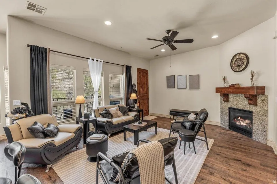 Wood-finish flooring, recessed lighting, and a ceiling fan