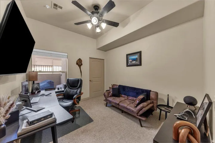 Recessed lighting, ceiling fan with integrated light fixture, window with blinds, interior door, and neutral wall tones