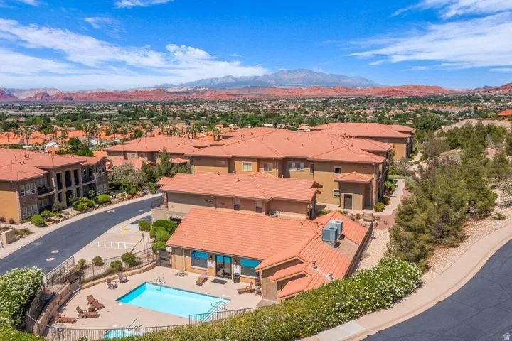Community pool with surrounding patio