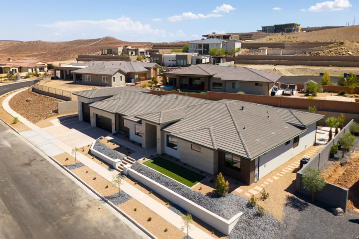 Contemporary exterior with a tiled roof and stucco finish