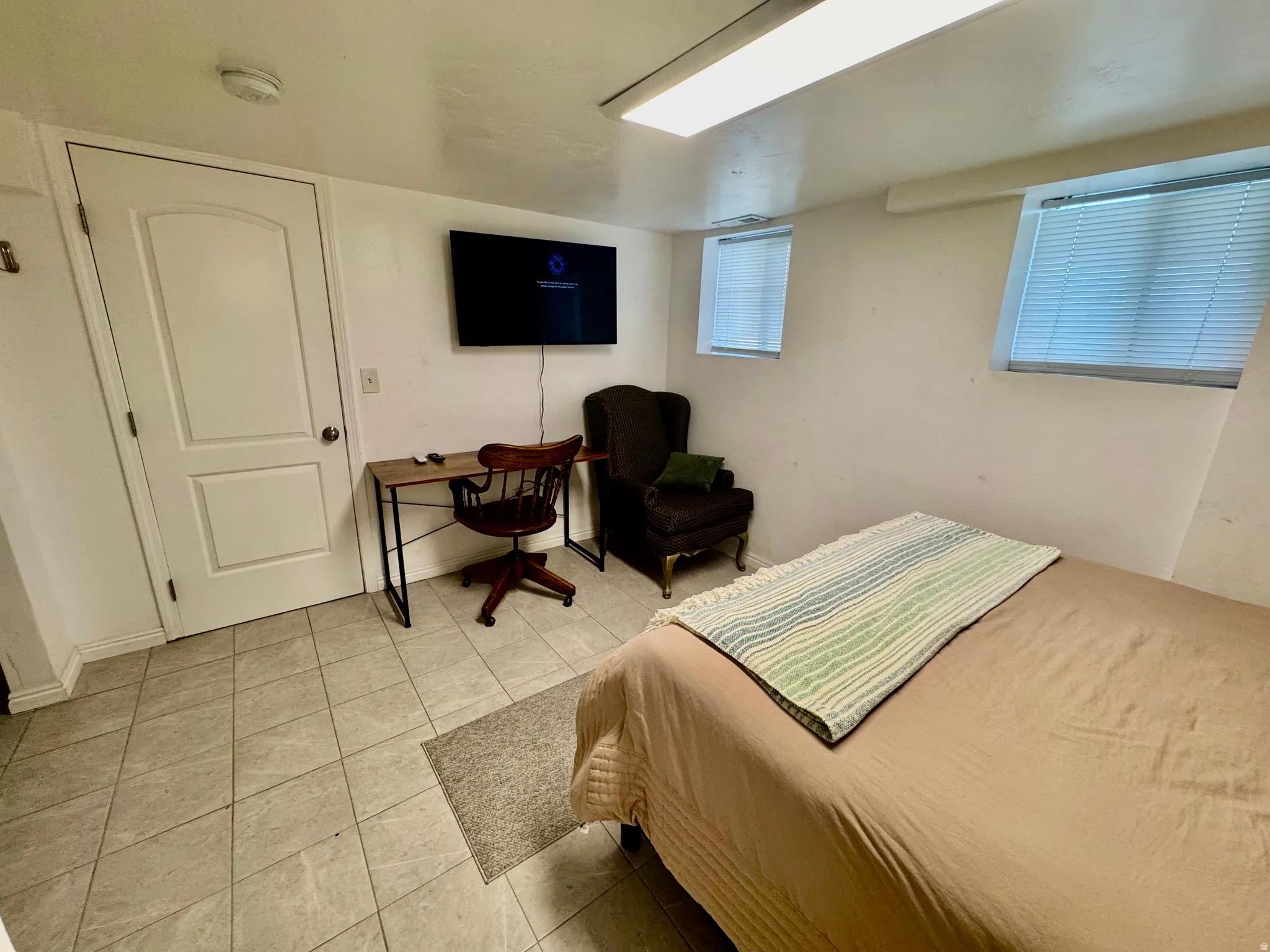 Room featuring tile flooring and white walls