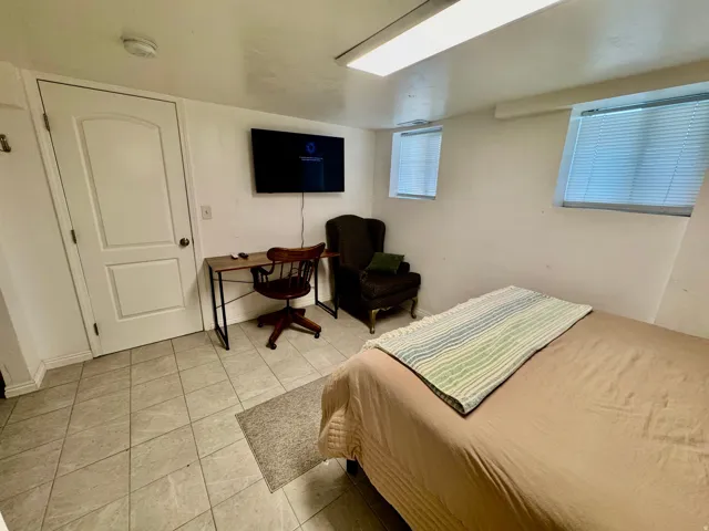 Room featuring tile flooring and white walls
