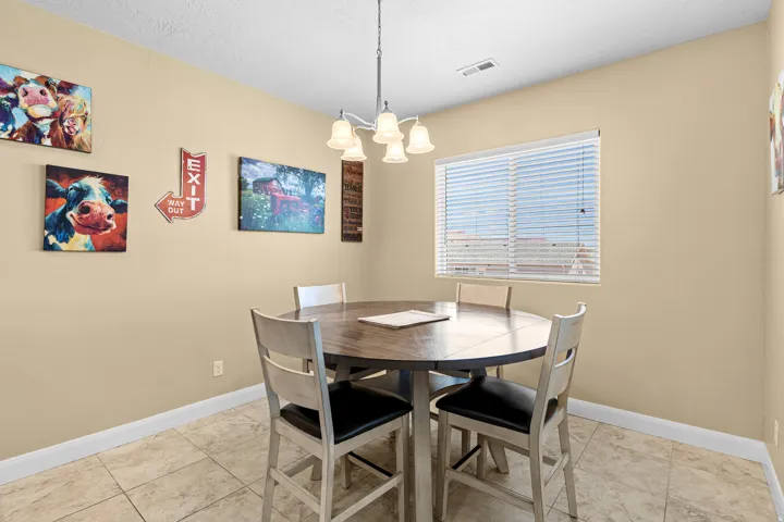 Recessed lighting, tiled flooring, and a single window with blinds