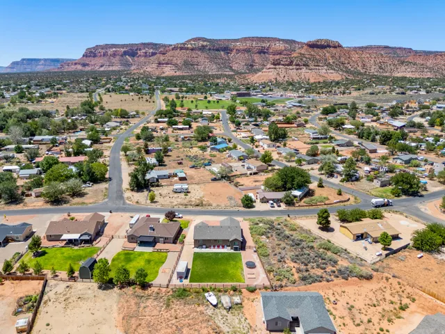 Expansive residential area featuring established homes and natural desert landscaping against a prominent mountain backdrop