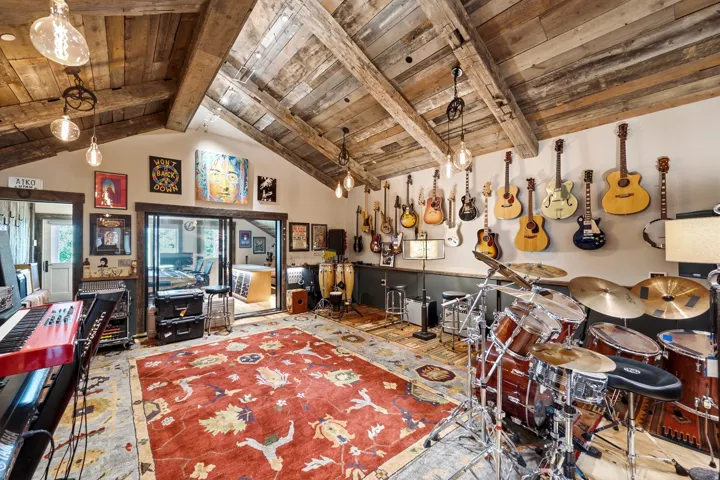 Vaulted wood-paneled ceiling with exposed beams