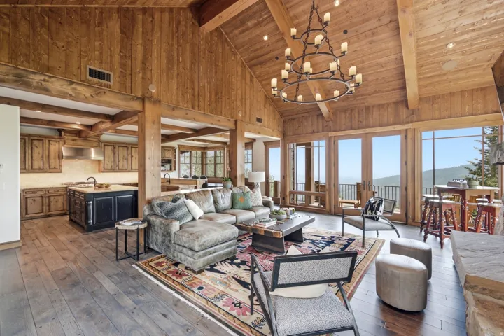 Vaulted wood-paneled ceilings, exposed wood beams, and wood-finish flooring