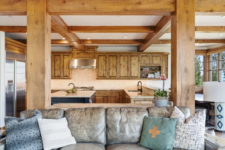 Open-concept kitchen with wood cabinetry, stainless steel appliances, and a central island
