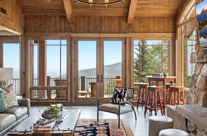Wood-paneled walls and ceiling with exposed beams
