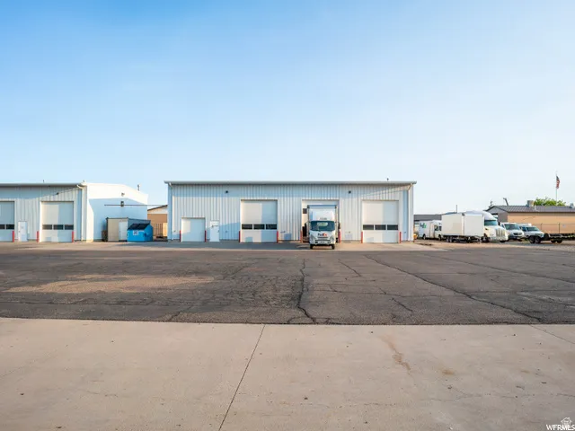 Commercial buildings with metal siding and multiple roll-up doors