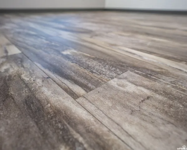 Wood-finish flooring with varied plank patterns