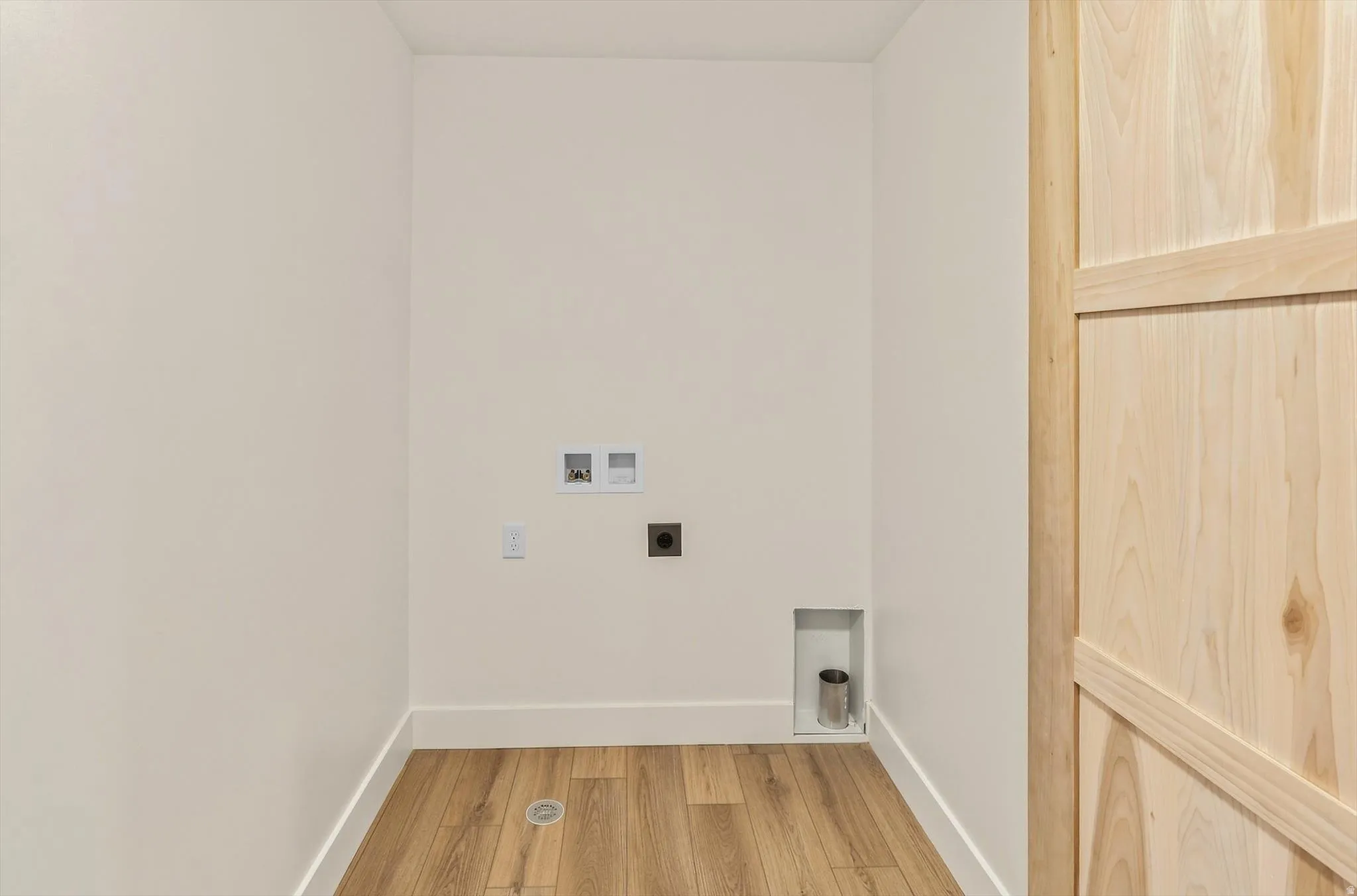 Wood-finish flooring with crisp white baseboards