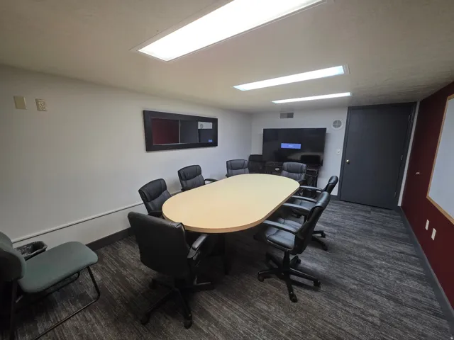 Recessed ceiling lighting, durable carpeting, and a wall-mounted display