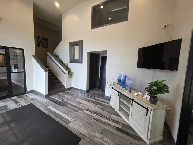 Wood-finish flooring throughout the entry
