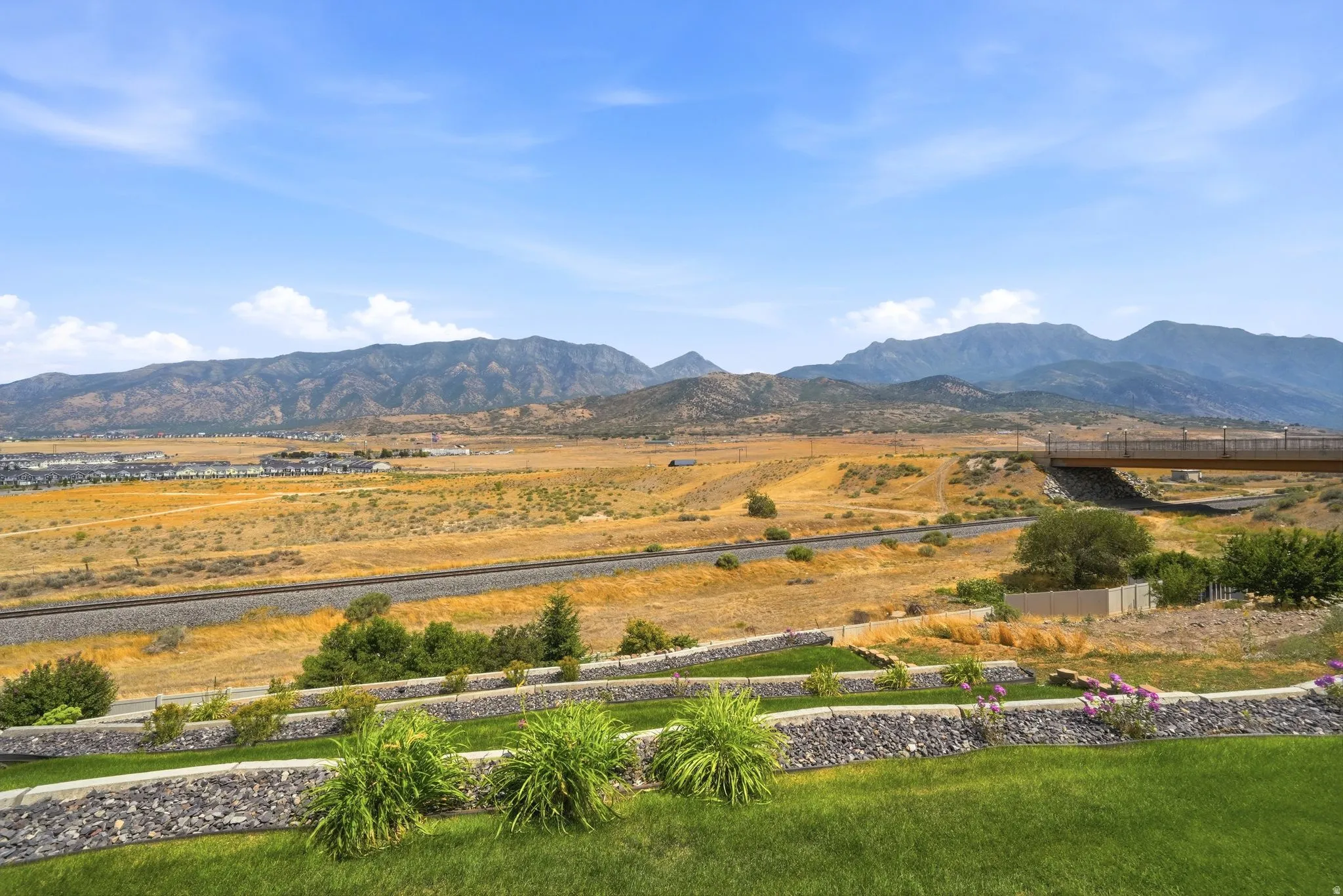 Expansive open land with distant mountain ranges