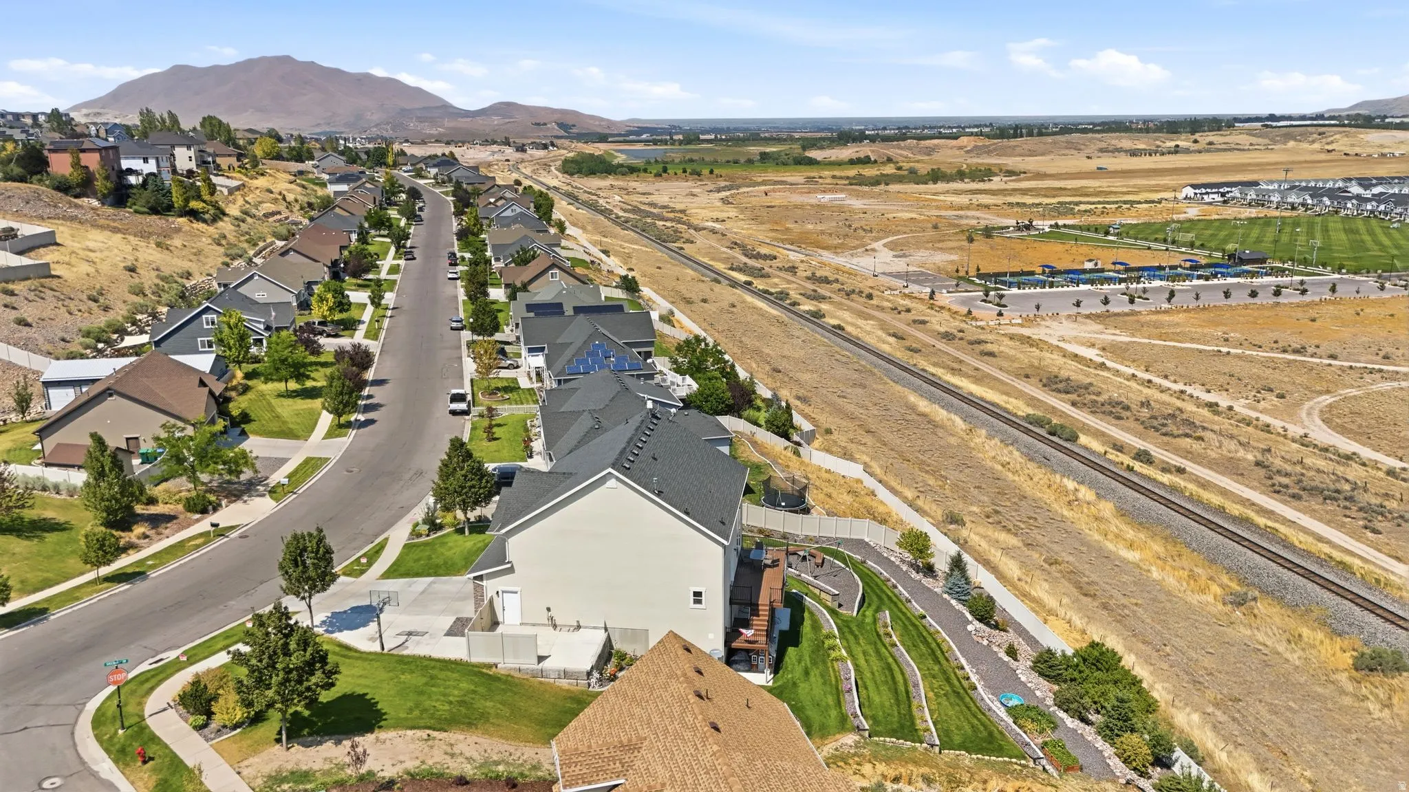 Residential neighborhood with established homes, paved streets, and green landscaping