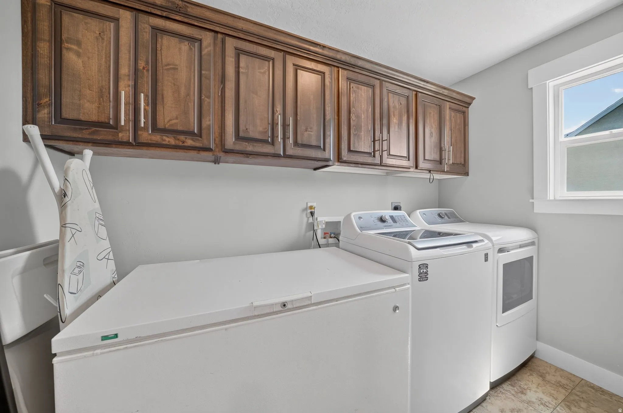 Wood-finish cabinetry and light gray walls