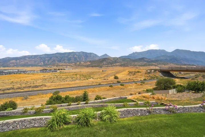 Expansive open land with distant mountain ranges