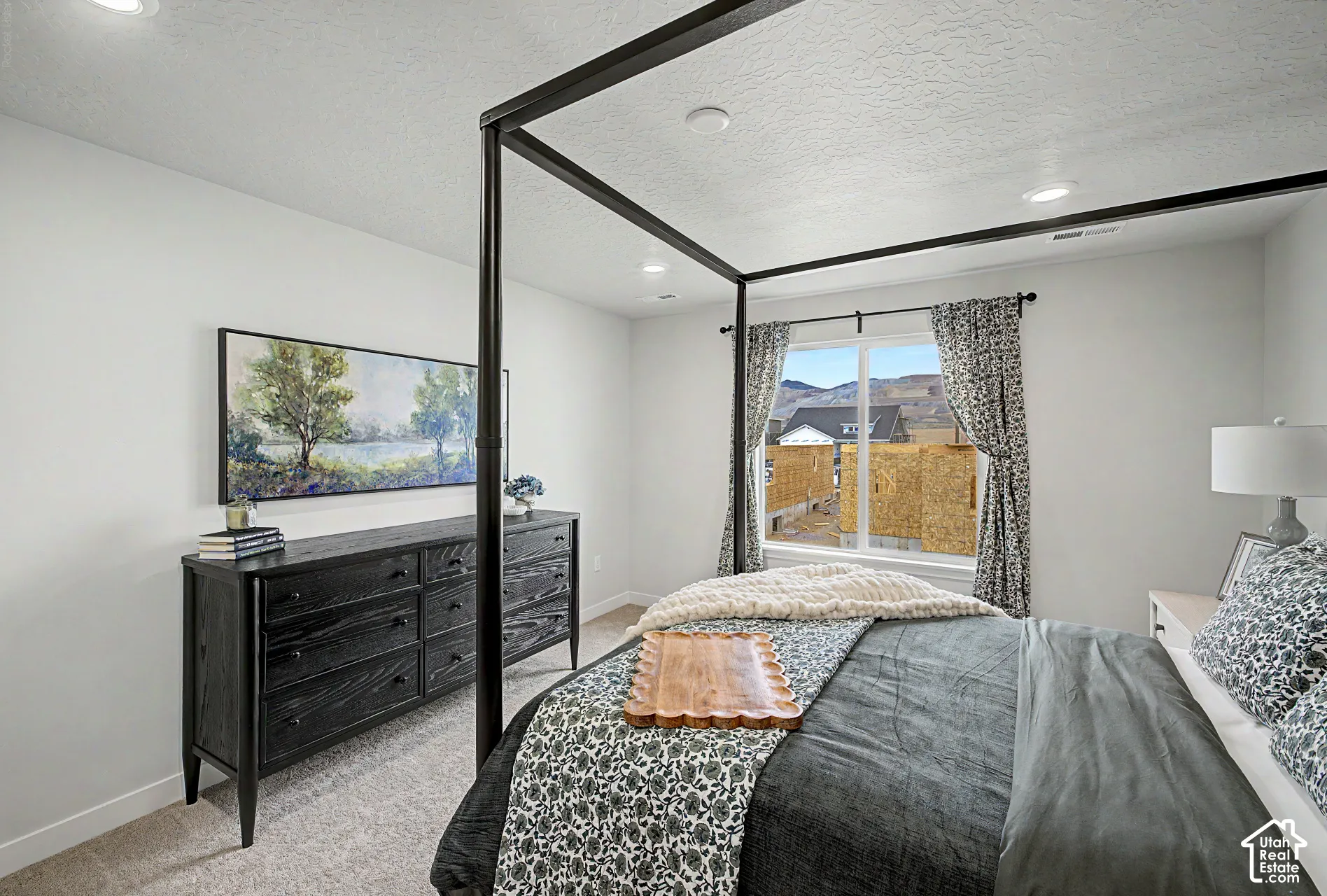 Recessed lighting, large window, carpeted flooring, and neutral wall tones