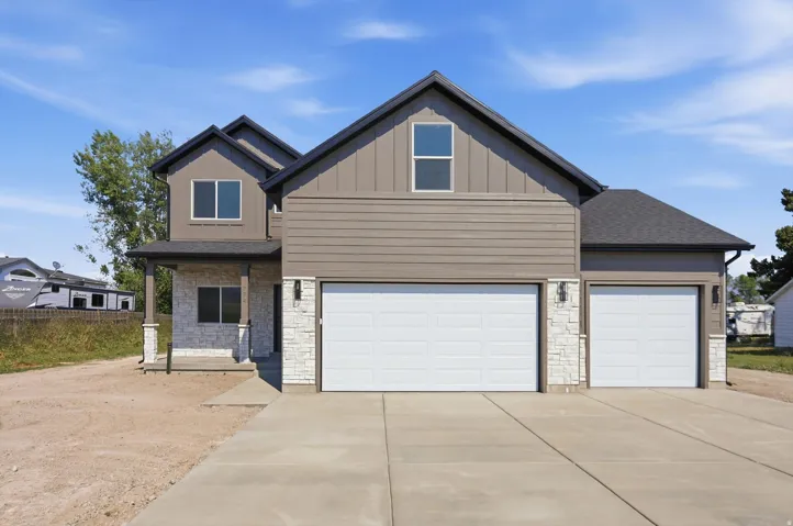 Two-story residence featuring a combination of horizontal siding and vertical board and batten