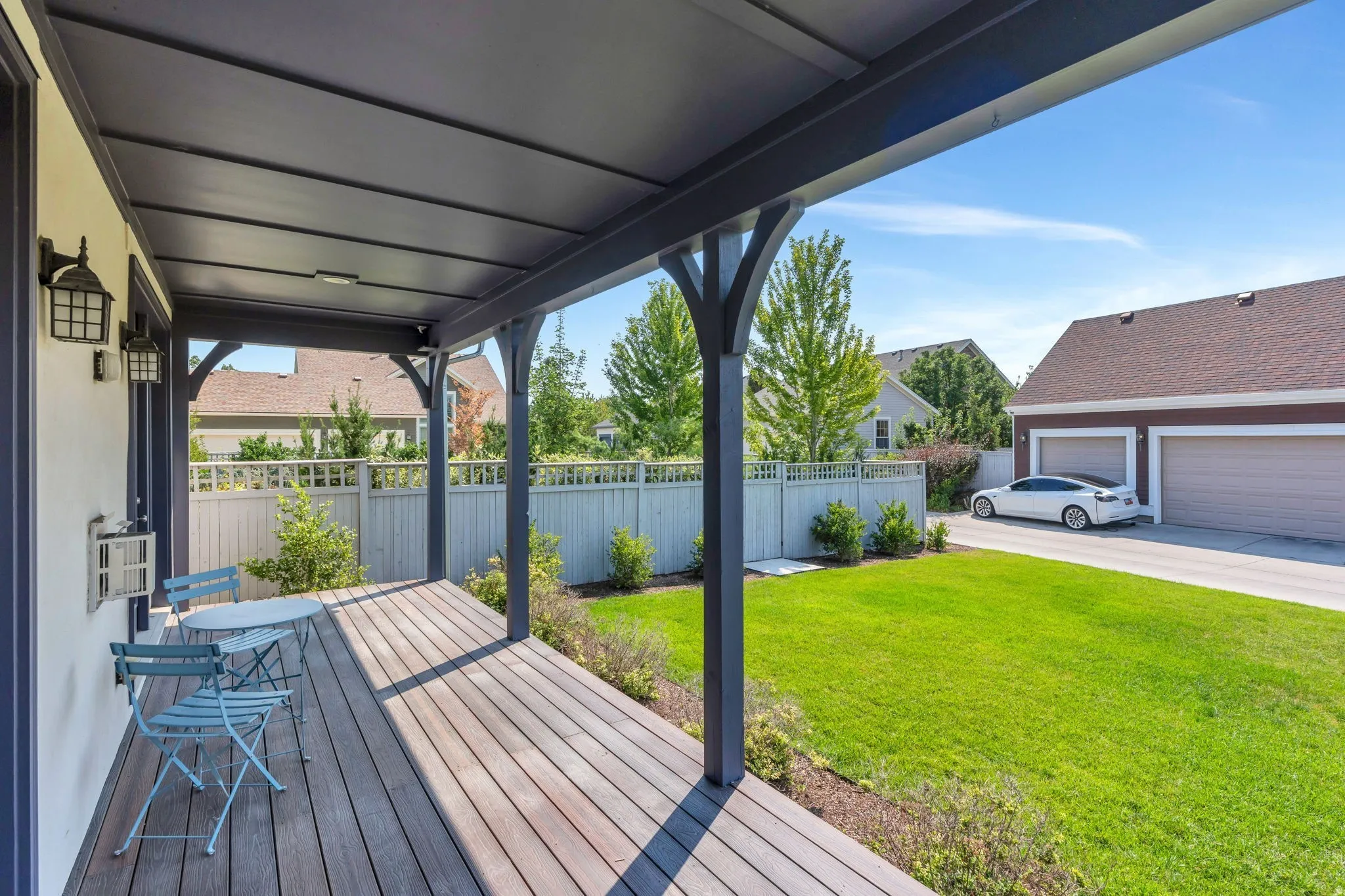 Covered wood-finish porch with overhead lighting