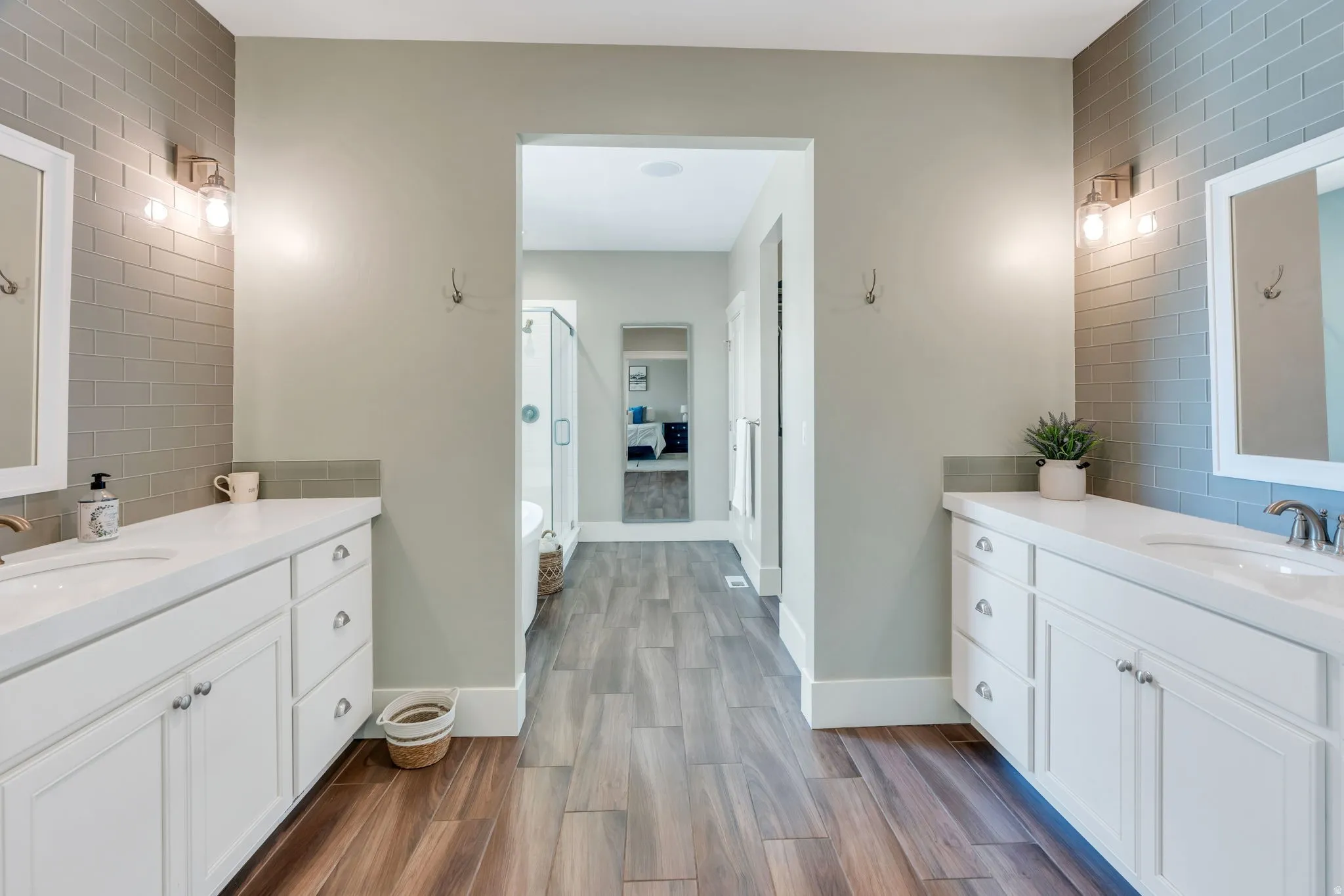 Dual vanity with white cabinetry and integrated sinks