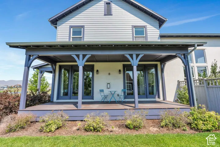 Covered porch offers great space to unwind or entertain guests!