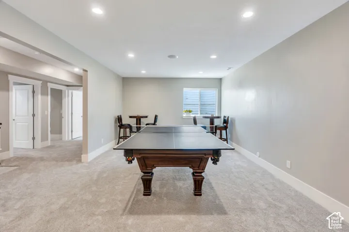 Recessed lighting, light gray wall paint, and white trim
