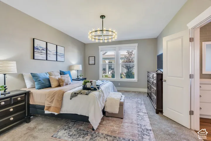 Plush carpeting, neutral wall tones, and recessed lighting create a comfortable atmosphere