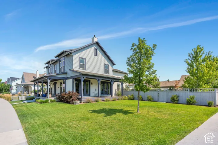 Including mature trees, lush grass and a spacious front patio and side porch!