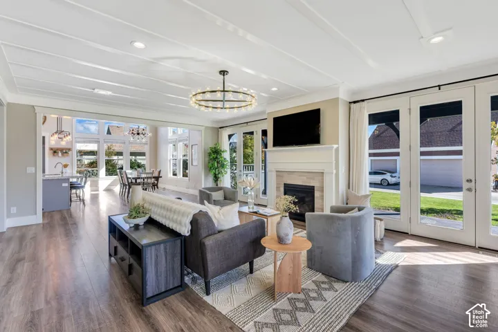 Including a built-in gas log fireplace with custom mantle and access to the side yard via french doors!