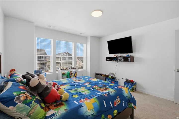 Wall-to-wall carpeting and white walls
