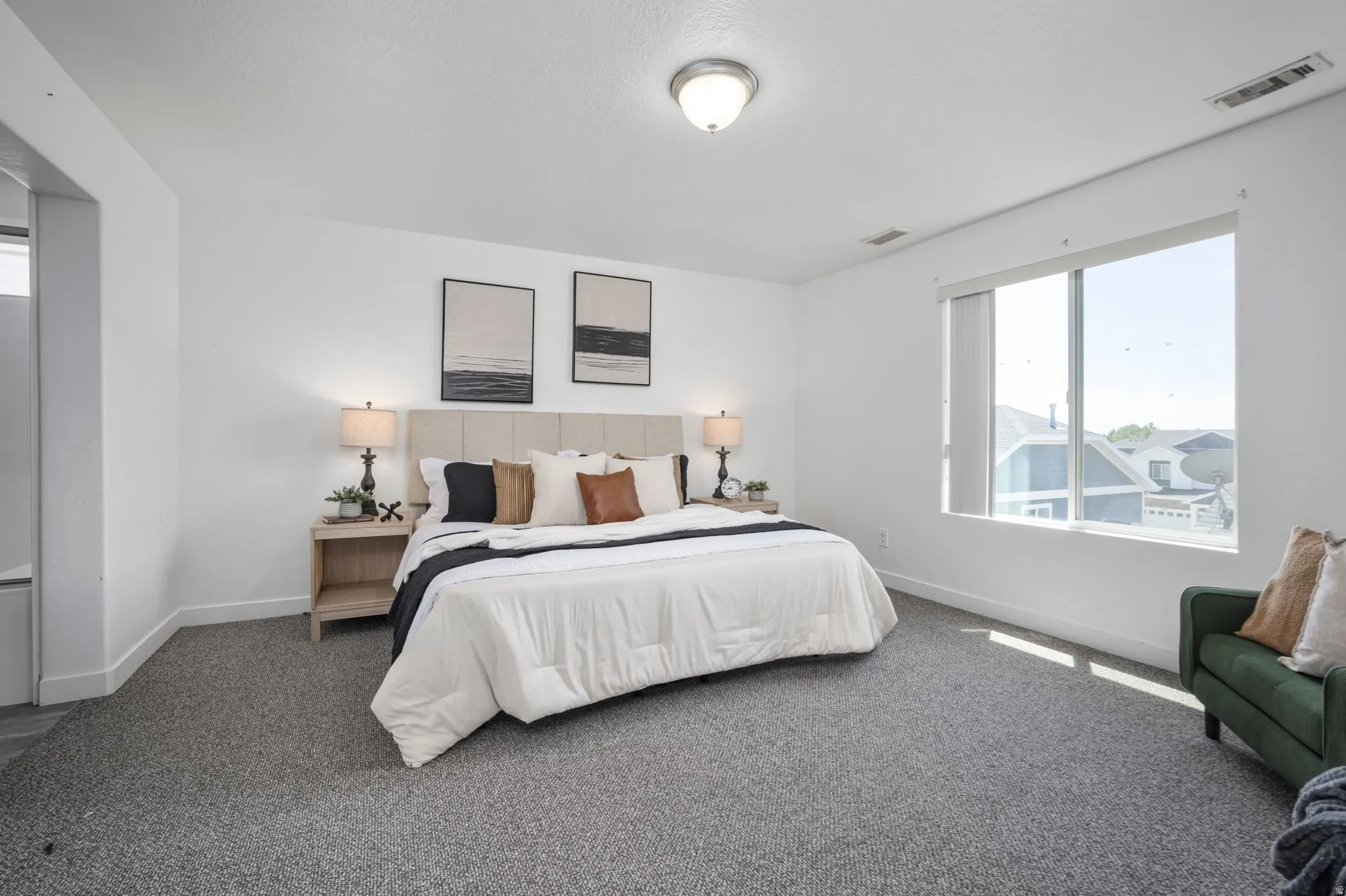 Wall-to-wall carpeting with light-colored walls and a semi-flush mount ceiling light