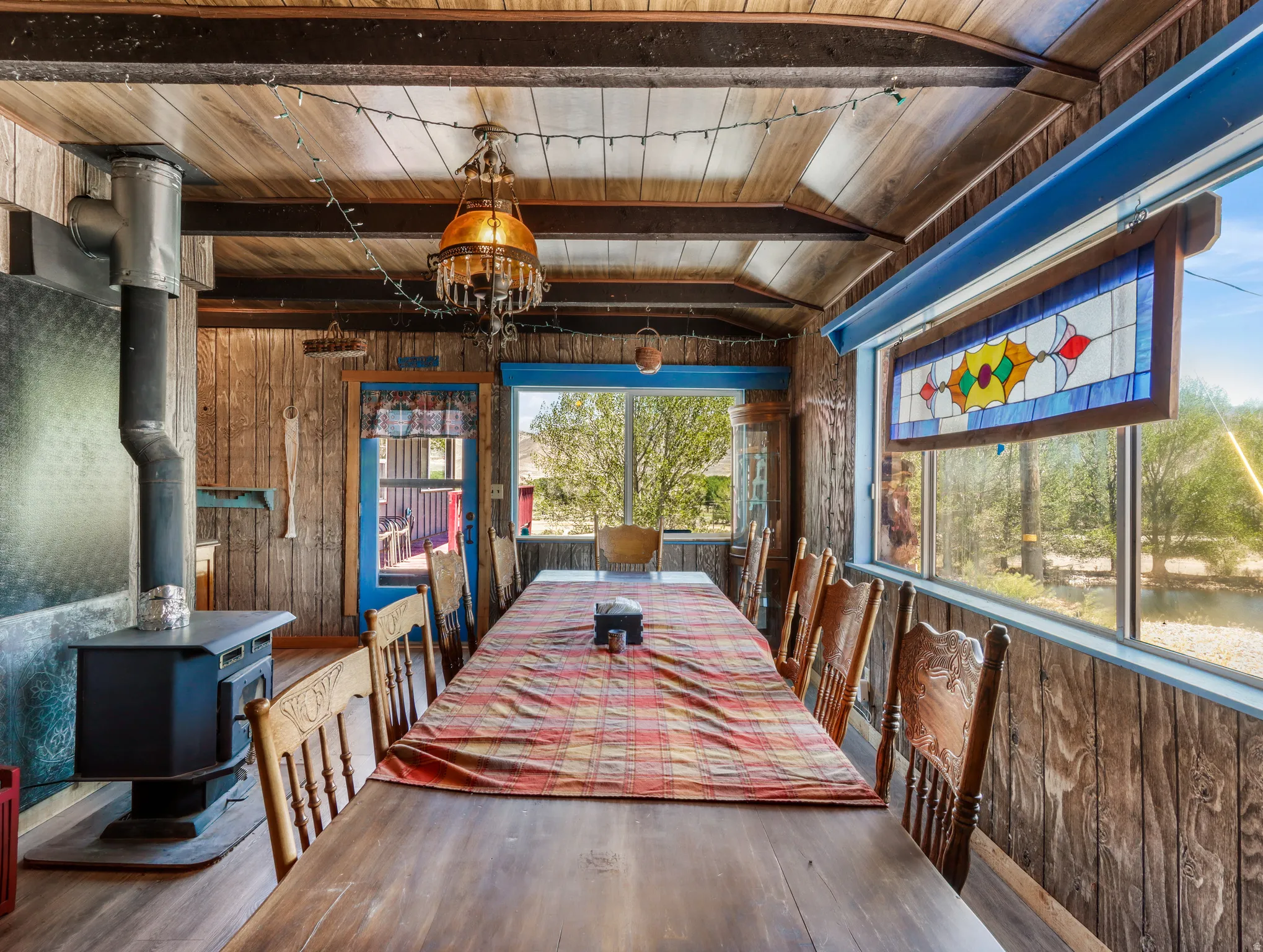 Wood-paneled walls and ceiling with exposed beams