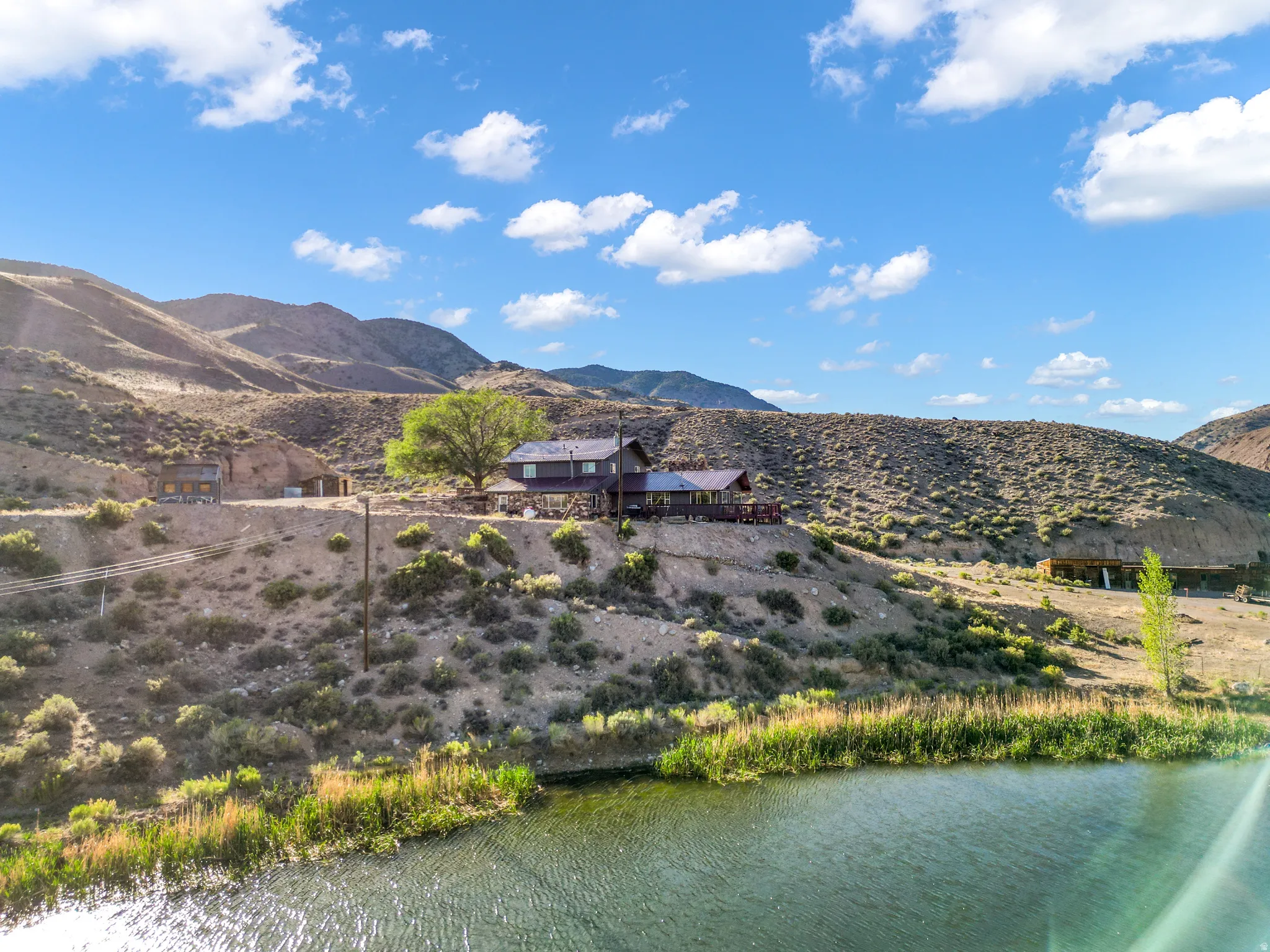 Waterside property with a main residence and a detached structure