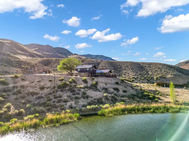 Waterside property with a main residence and a detached structure