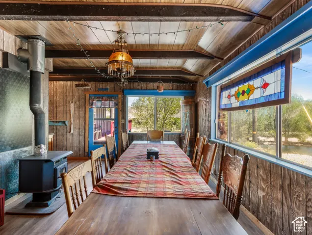 Wood-paneled walls and ceiling with exposed beams