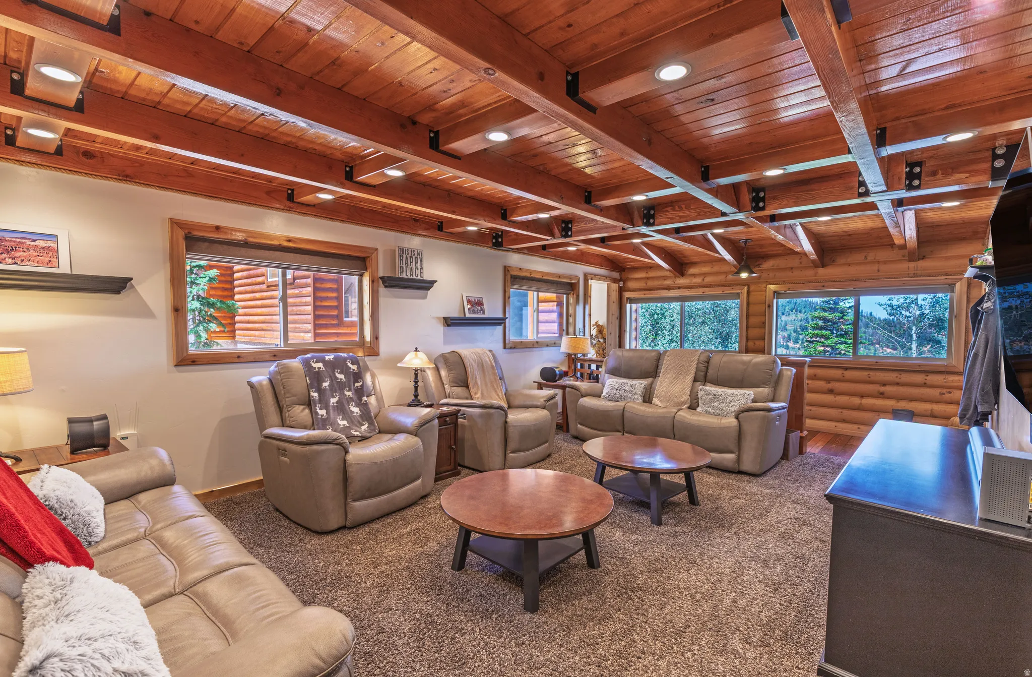 Exposed wood beam ceiling with recessed lighting