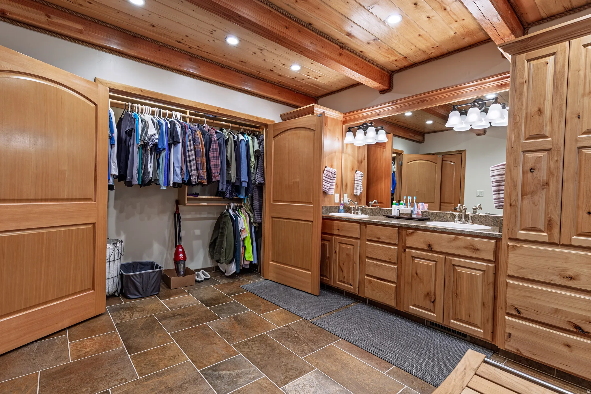 Wood-finish ceiling with exposed beams and recessed lighting