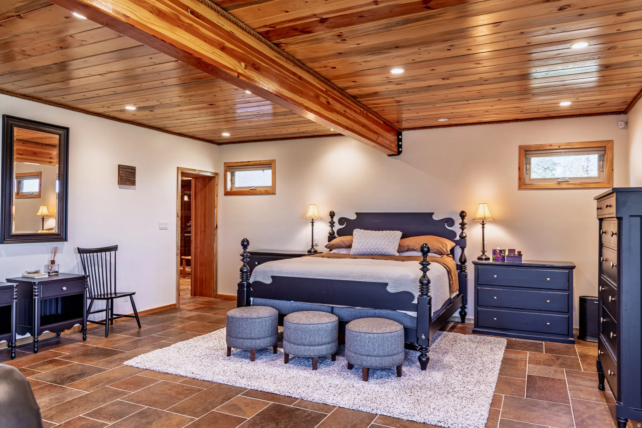 Wood plank ceiling with integrated recessed lighting